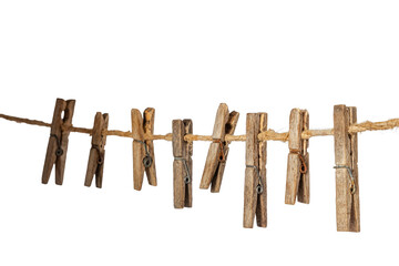 Old wooden clothespins, laundry hooks, on hemp rope, white background