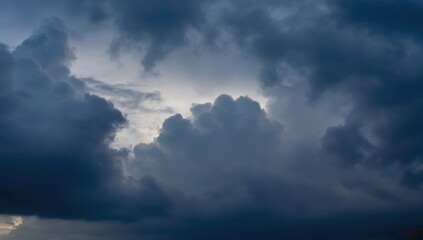 Lightning bolt cutting through dark storm clouds in a dramatic night sky capturing the raw power of nature and extreme weather conditions perfect for stock photography and natural background visuals.