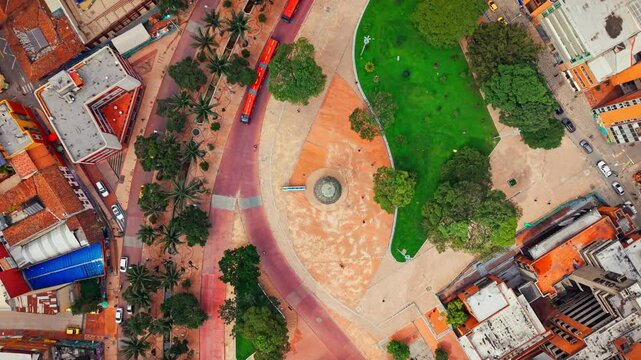 Aerial tops down Colombian Bogot&aacute; capital city traffic, buildings Periodistas urban park Gabriel Garcia Marquez in summer daylight