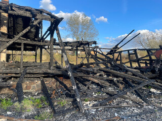 Burned down home with fire damage in the countryside