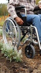 Enjoying a sunny early fall afternoon, someone using a wheelchair engages in gardening activities at a vibrant community garden