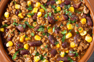 Traditional Mexican Chili con carne. Minced meat and vegetables stew in tomato sauce. Close up