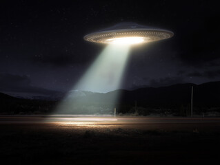 Alien spaceship hovering over desert road at night