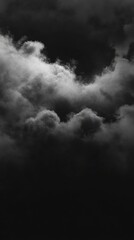 Dramatic monochrome sky with billowing clouds creating a moody and atmospheric scene from below perspective
