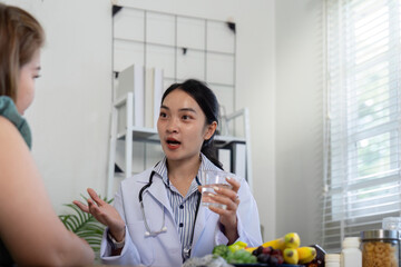 Nutrition and Patient Engagement. A healthcare professional discussing hydration and nutrition with...