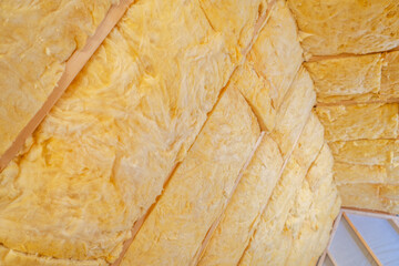 Insulation Installation Process in a Residential Building Attic