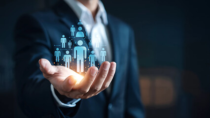 Businessman Holding Digital Human Icons Representing Team Management Human Resources Leadership And Employee Network