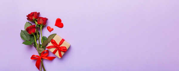 Valentine's day composition with rose flower, red heart and gift boxes on table. mother day and...