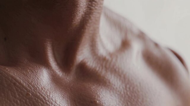 Glistening sweat beads on skin covered in goosebumps, creating a captivating texture that emphasizes the body's physiological reactions to stimuli like cold, fear, or excitement