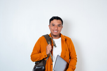 Image of handsome young Asian student holding laptop and using backpack on isolated white background