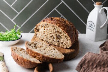 Homemade rye bread with seeds on a wooden board.