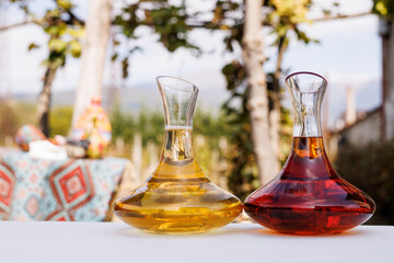 Two Decanters with different types of wine on the Outdoor Table