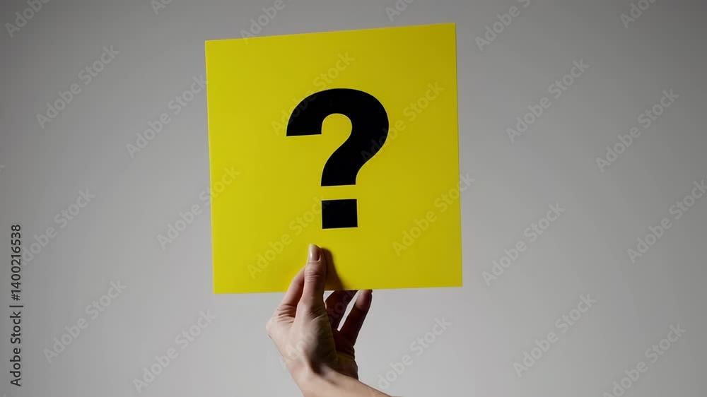 Aufkleber Yellow paper displaying oversized question mark, representing curiosity and uncertainty while highlighting problem solving communication against pristine white background