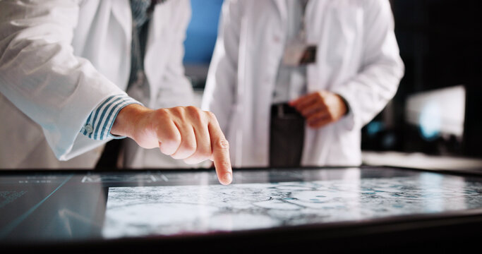 Scientist, hands and pointing with screen for lab review, medical research or teamwork. Computer table, interactive display and clinical analysis for science data, people meeting and study results