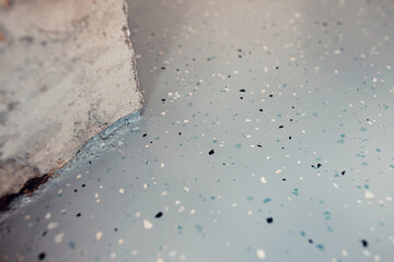 Premature floor finishing with bush hammering and epoxy coating issues