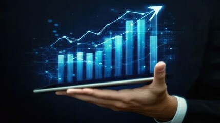 A hand holding a tablet displaying a digital graph showing upward growth.
