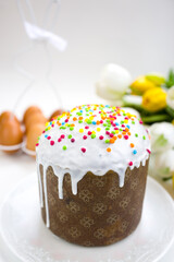 Traditional Easter cake with eggs and flowers on a white background. The Bright Easter Holiday