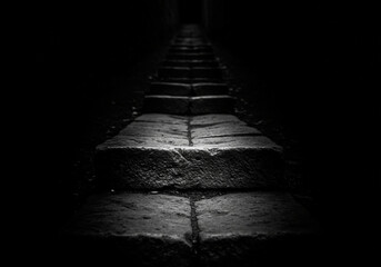 Dimly Lit Stone Steps Leading Into Darkness  
