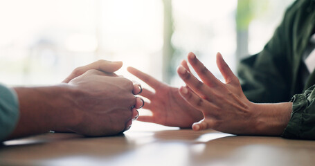 Argument, confession or conflict with hands of couple in home together for discussion or...