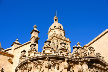 Obraz premium Complex stone decorations and the steeple of the Cathedral Churc