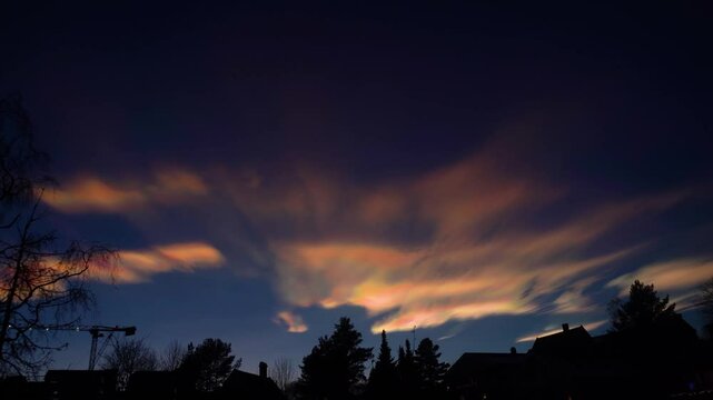 Witness the rare beauty of mother-of-pearl clouds with vibrant iridescent hues dancing across Norway&rsquo;s skies, captured in stunning detail to showcase this mesmerizing atmospheric phenomenon.