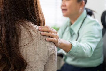 Empathy and Support in Healthcare. A doctor shows compassion by comforting a patient during a medical consultation.