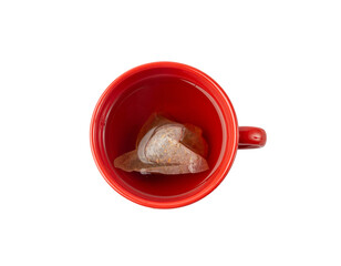 Herbal tea sachet in cup, hot water with chamomile and Hypericum or St. John's wort teabag