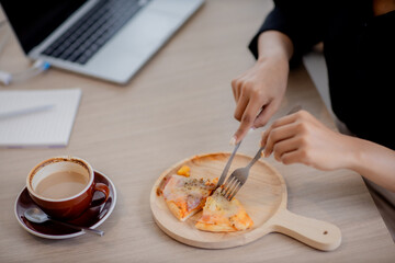 Sitting in a pizza eating coffee shop