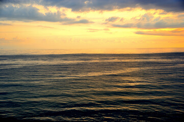Fototapeta premium Bird's eye view of the sea at sunset.