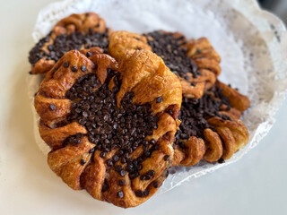 Traditional Hamburg pastry Franzbroetchen made from puff pastry, sugar and cinnamon with chocolate...