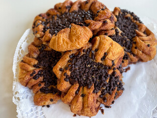 Traditional Hamburg pastry Franzbroetchen made from puff pastry, sugar and cinnamon with chocolate...