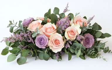 Elegant floral arrangement of pastel roses and eucalyptus