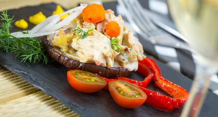 Chopped chicken breast with mustard sauce served on roasted eggplant slice