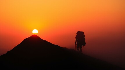 Obraz premium Sunset Silhouette of a Hiker