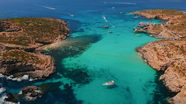Aerial view White yacht stands in azure transparent water sea, beach Blue Lagoon Comino Malta