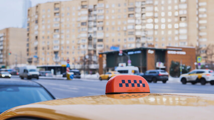 Yellow taxi cab waiting for passenger in city street
