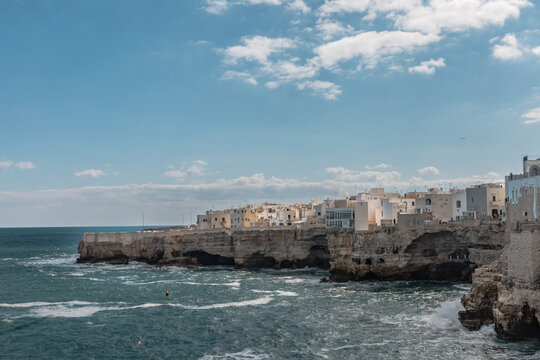 Rocky Coastline of Polignano a Mare with Clear Blue Sea - Powered by Adobe