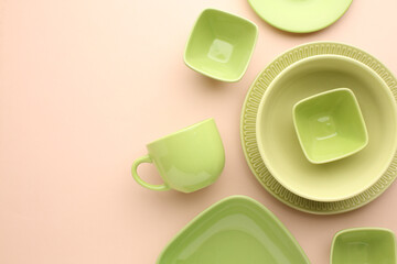Beautiful multi-coloured bright ceramic bowl and tarenes, on a table top view