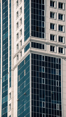 many windows and walls facade of a modern skyscraper without people