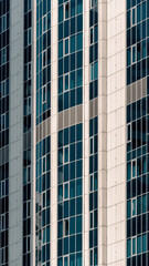 Fototapeta premium many windows and walls facade of a modern skyscraper without people