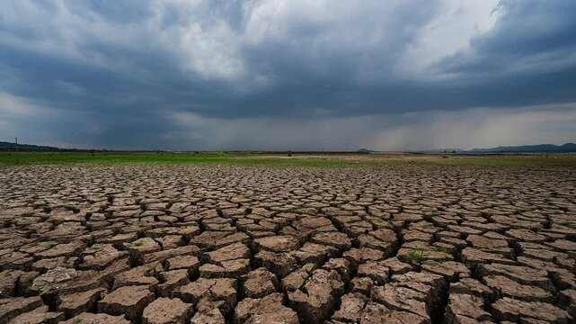 Time Lapse area of cracked soil caused by long draught Dry landscape with crack pattern caused by lack of water.