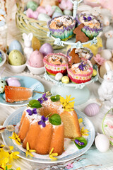 Easter table with traditional ring cake, muffins and decors
