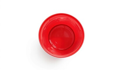 Striking red bowl displayed on a simple surface with soft background lighting and artistic flair