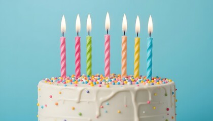 A celebratory birthday cake with seven brightly colored, spiraled candles burning against a pastel blue background, a joyful symbol of sweet wishes and happy memories.