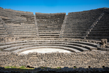 Ancient Roman Theatre of the ancient Roman city of Pompeii, buried by the eruption of Mount Vesuvius in 79 AD, with Mount Vesuvius visible in the distance, Italy
