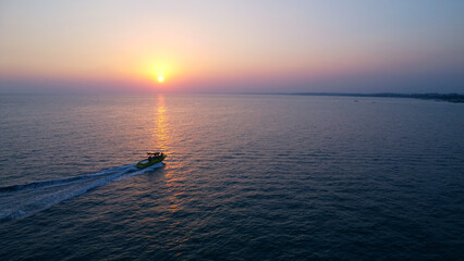 Speedboat at Sunset on a Calm Sea