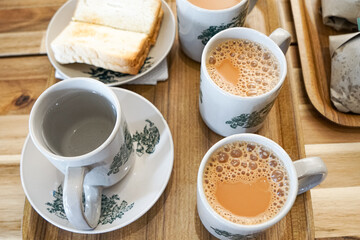 Popular drink in Malaysia called Teh Tarik. It is a sweet drink made from tea with milk. Fractal on the cup is generic print.