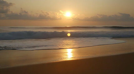 Fototapeta premium Golden Sunrise Reflecting on Ocean Waves and Sandy Beach with Clouds in Background Early Light on Coastal Seascape