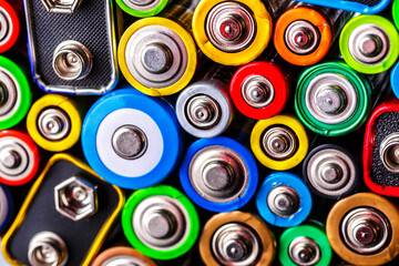 Energy abstract background of colorful batteries.Old used batteries ready for recycling.Used...