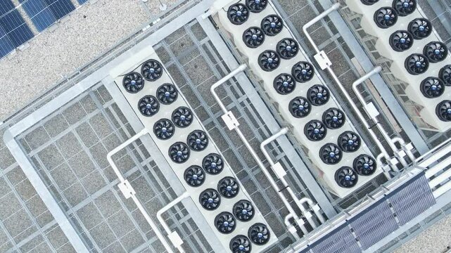 Aerial view of ventilators and HVAC systems on data center rooftop, cooling infrastructure for server operations